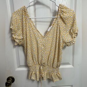 sienna sky yellow floral crop top, puff sleeves, tie waist, runs slightly big